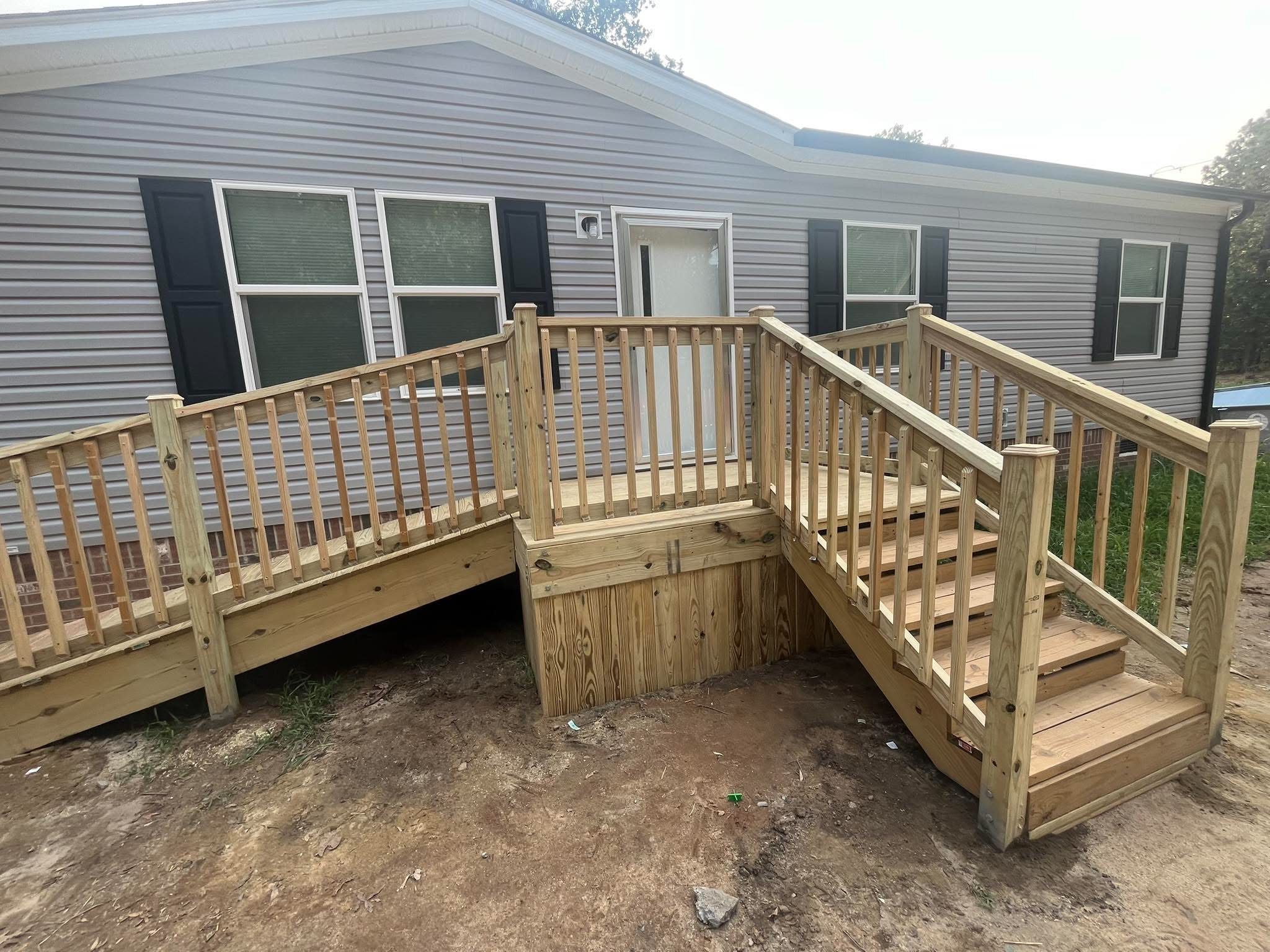 Finished wood deck with stairs and railing
